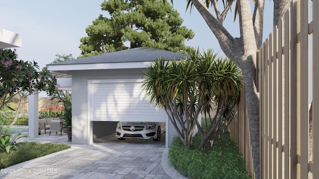 2059 Barracuda Ave, Melbourne Beach, FL 32951 - garage featuring decorative driveway