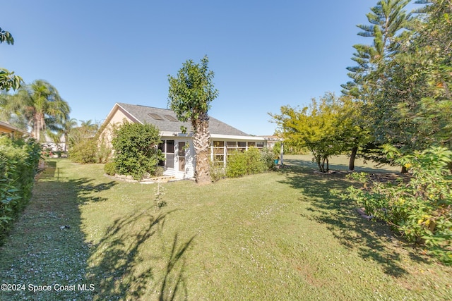 4001 Bayberry Dr, Melbourne, FL 32901 - view of yard featuring a sunroom