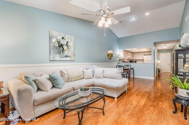 4001 Bayberry Dr, Melbourne, FL 32901 - living room featuring recessed lighting, light wood-style floors, ceiling fan, and high vaulted ceiling