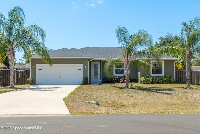 ranch-style home featuring driveway, a garage, fence, a front lawn, and stucco siding