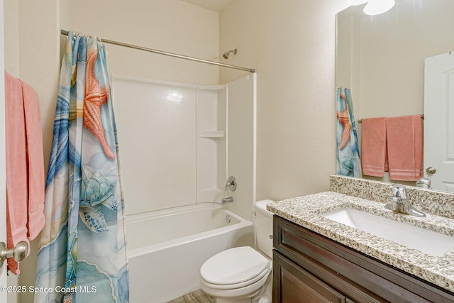 bathroom with toilet, shower / bath combo, and vanity
