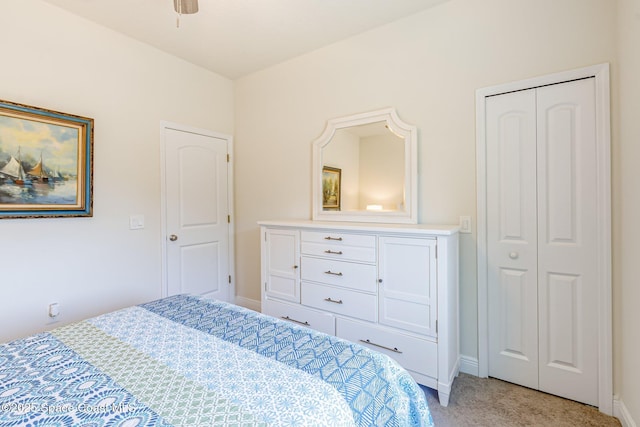 bedroom with baseboards and light carpet