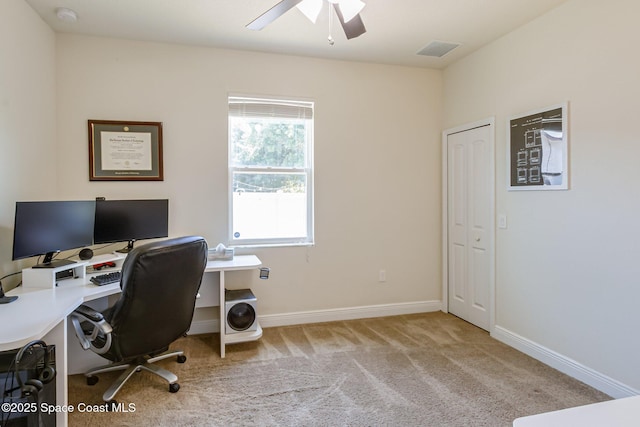 office area with visible vents, carpet, ceiling fan, and baseboards