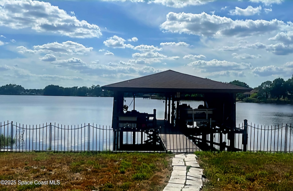 view of dock featuring boat lift and a water view