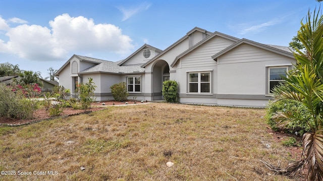 2615 Slash Pine Ct, Titusville, FL 32780 - ranch-style home with a front lawn and stucco siding