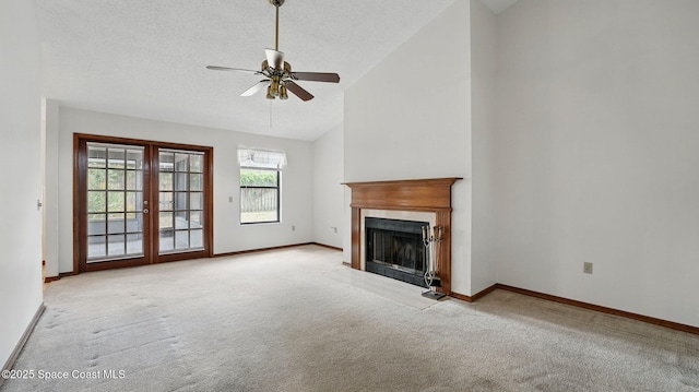 2615 Slash Pine Ct, Titusville, FL 32780 - unfurnished living room with a ceiling fan, a fireplace, baseboards, french doors, and carpet flooring