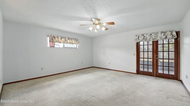 2615 Slash Pine Ct, Titusville, FL 32780 - carpeted spare room with french doors, baseboards, a ceiling fan, and a textured ceiling