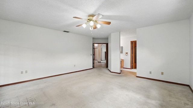 2615 Slash Pine Ct, Titusville, FL 32780 - interior space featuring baseboards, light carpet, a ceiling fan, and a textured ceiling