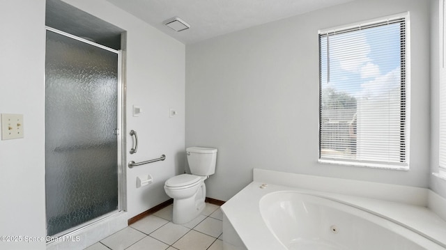 2615 Slash Pine Ct, Titusville, FL 32780 - bathroom featuring toilet, tile patterned floors, a shower stall, and a healthy amount of sunlight