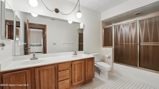 2615 Slash Pine Ct, Titusville, FL 32780 - full bath with tile patterned flooring, a sink, double vanity, and toilet