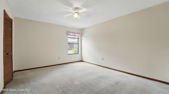 2615 Slash Pine Ct, Titusville, FL 32780 - empty room featuring baseboards, a textured ceiling, light colored carpet, and ceiling fan