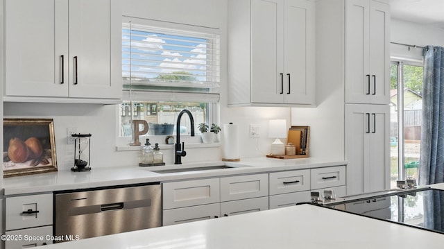 bar featuring stainless steel dishwasher and a sink