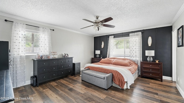 bedroom with ornamental molding, a ceiling fan, dark wood-style flooring, and a textured ceiling