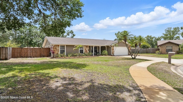 ranch-style home with concrete driveway, an attached garage, fence, and a front yard