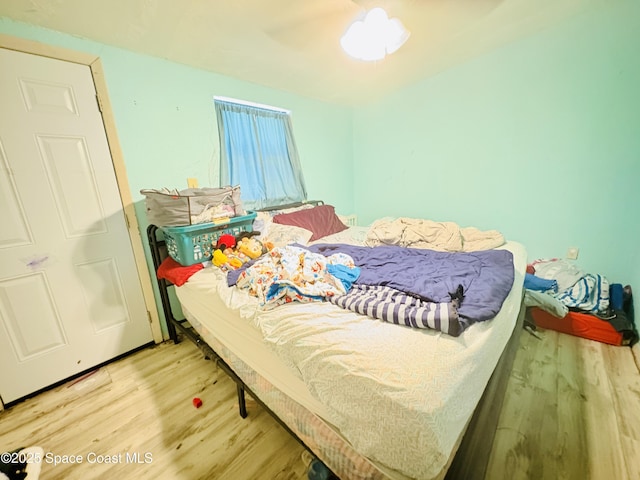 bedroom featuring wood finished floors