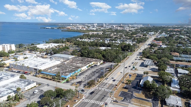 bird's eye view featuring a water view and a city view