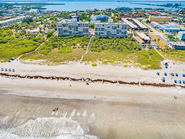 bird's eye view featuring a beach view and a water view