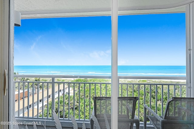 exterior space featuring a beach view and a water view