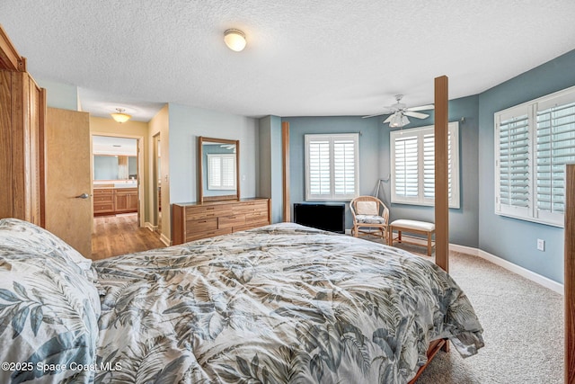 bedroom with baseboards and a textured ceiling