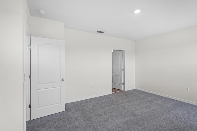 spare room featuring recessed lighting, baseboards, visible vents, and carpet