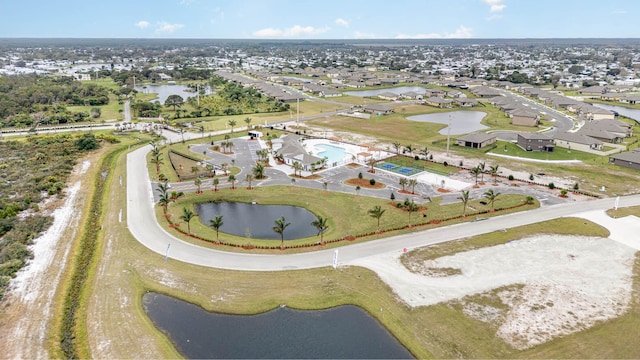 drone / aerial view with a water view and a residential view