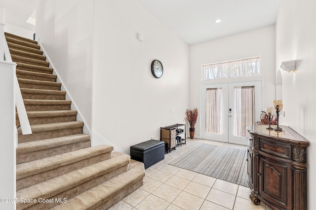 3502 Tipperary Dr, Merritt Island, FL 32953 - entryway featuring stairs, a high ceiling, light tile patterned floors, french doors, and recessed lighting
