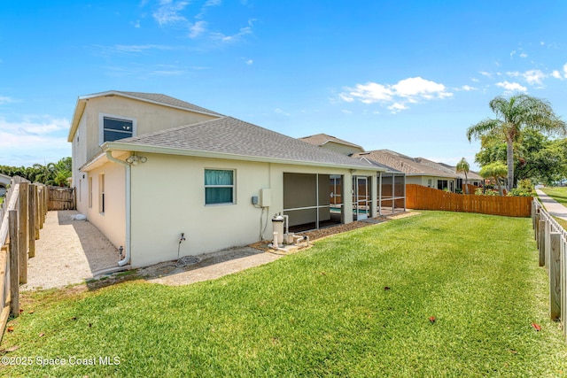 3502 Tipperary Dr, Merritt Island, FL 32953 - back of house with stucco siding, roof with shingles, and a sunroom