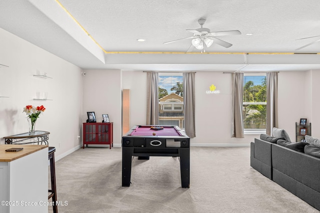 3502 Tipperary Dr, Merritt Island, FL 32953 - recreation room with light carpet, baseboards, a textured ceiling, and a ceiling fan
