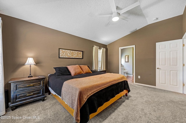 carpeted bedroom featuring visible vents, ceiling fan, connected bathroom, a textured ceiling, and vaulted ceiling