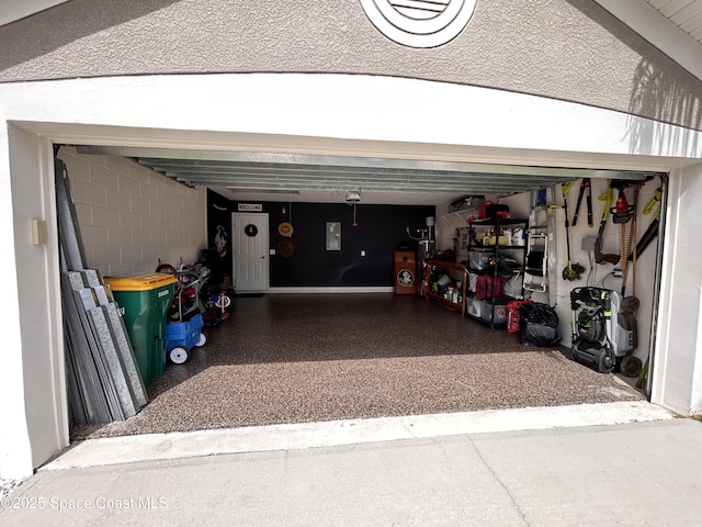 garage featuring concrete block wall