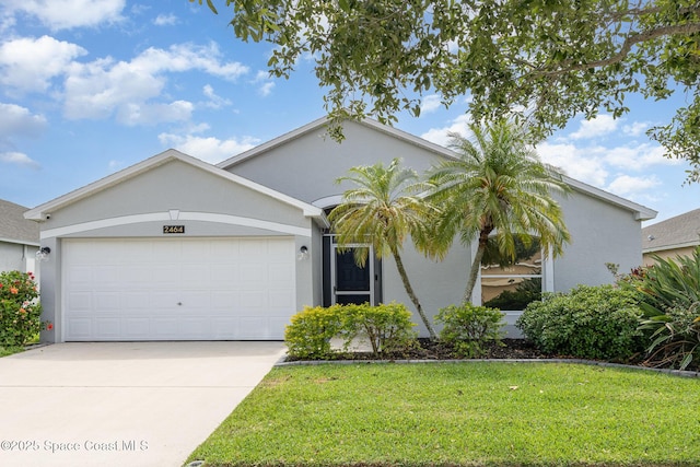 2464 Bayhill Dr, Melbourne, FL 32940 - ranch-style house featuring an attached garage, concrete driveway, a front lawn, and stucco siding