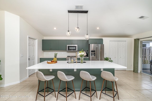 2464 Bayhill Dr, Melbourne, FL 32940 - kitchen featuring appliances with stainless steel finishes, a sink, light tile patterned flooring, light countertops, and recessed lighting