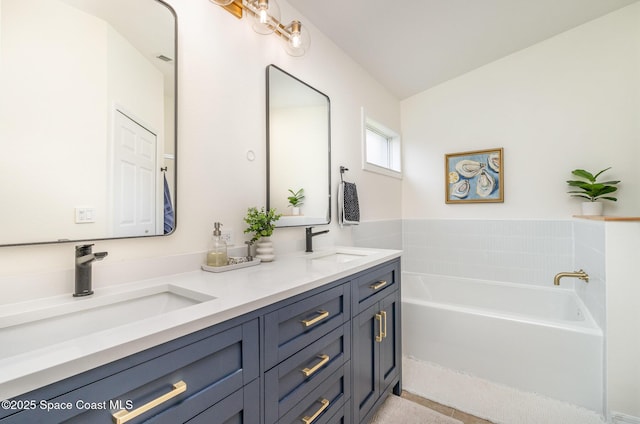 2464 Bayhill Dr, Melbourne, FL 32940 - bathroom featuring double vanity and a bath