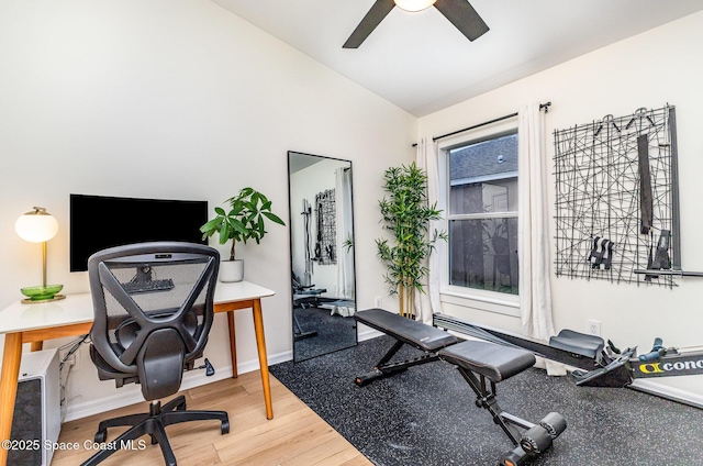 2464 Bayhill Dr, Melbourne, FL 32940 - workout room featuring vaulted ceiling, ceiling fan, wood finished floors, and baseboards