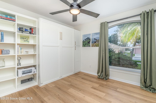 2464 Bayhill Dr, Melbourne, FL 32940 - spare room featuring light wood-style floors, ceiling fan, and baseboards