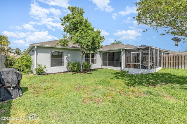 2464 Bayhill Dr, Melbourne, FL 32940 - rear view of property featuring a sunroom, stucco siding, and roof with shingles