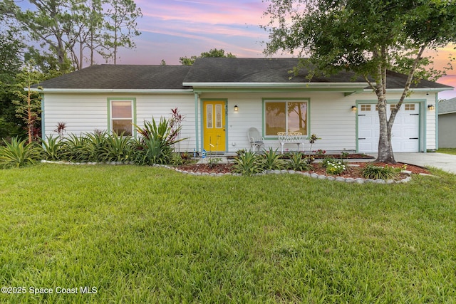 1435 Xavier Ave SE, Palm Bay, FL 32909 - ranch-style house featuring a garage, a front lawn, roof with shingles, and concrete driveway