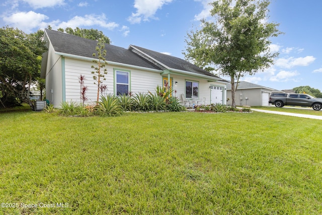 1435 Xavier Ave SE, Palm Bay, FL 32909 - ranch-style home with a garage, driveway, a front yard, and cooling unit