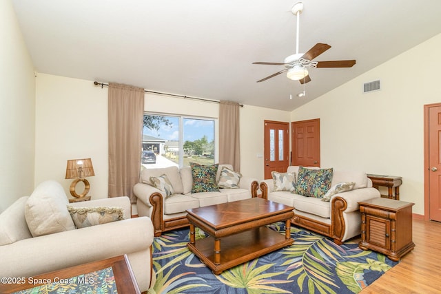 1435 Xavier Ave SE, Palm Bay, FL 32909 - living area featuring vaulted ceiling, a ceiling fan, wood finished floors, and visible vents