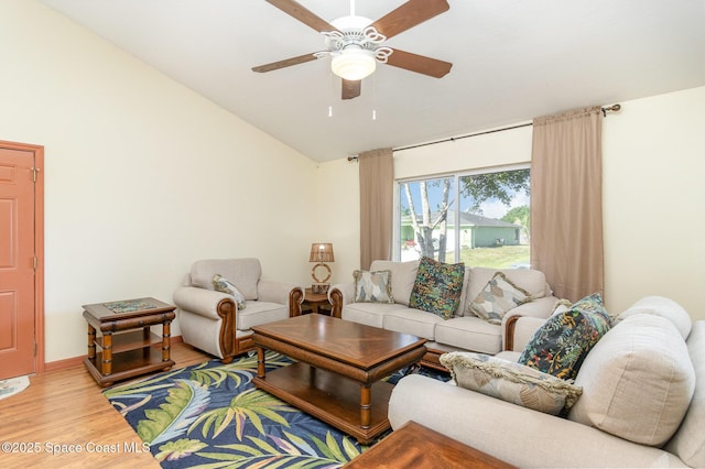 1435 Xavier Ave SE, Palm Bay, FL 32909 - living area with light wood-type flooring, a ceiling fan, and vaulted ceiling