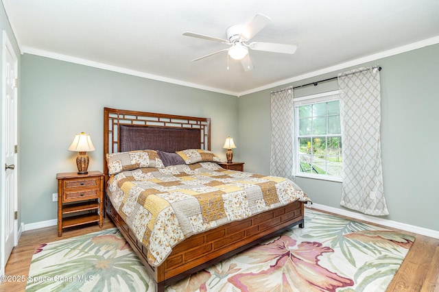 1435 Xavier Ave SE, Palm Bay, FL 32909 - bedroom with baseboards, ornamental molding, a ceiling fan, and wood finished floors