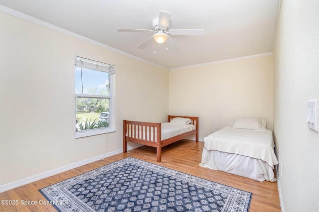 1435 Xavier Ave SE, Palm Bay, FL 32909 - bedroom featuring crown molding, baseboards, and light wood-style flooring