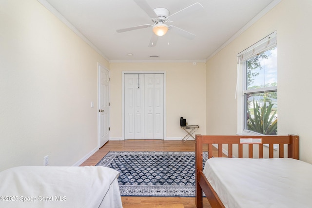 1435 Xavier Ave SE, Palm Bay, FL 32909 - bedroom featuring visible vents, ornamental molding, a closet, light wood-style floors, and baseboards