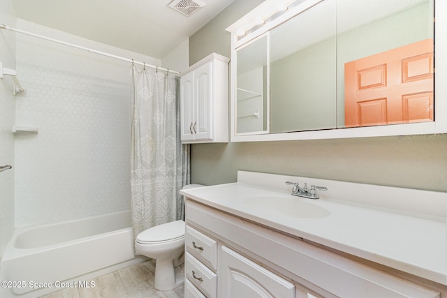 1435 Xavier Ave SE, Palm Bay, FL 32909 - bathroom featuring vanity, shower / bath combo, toilet, and visible vents