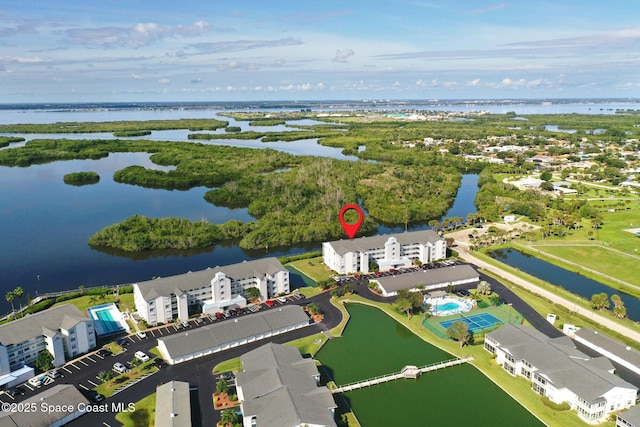 aerial view of a nearby body of water and apartment complex
