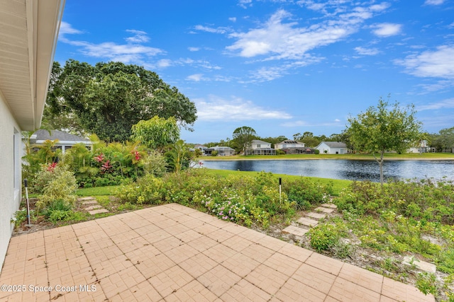 view of patio / terrace featuring a water view and a residential view