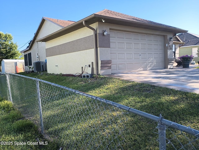 view of side of home featuring central air condition unit, an attached garage, fence, and stucco siding