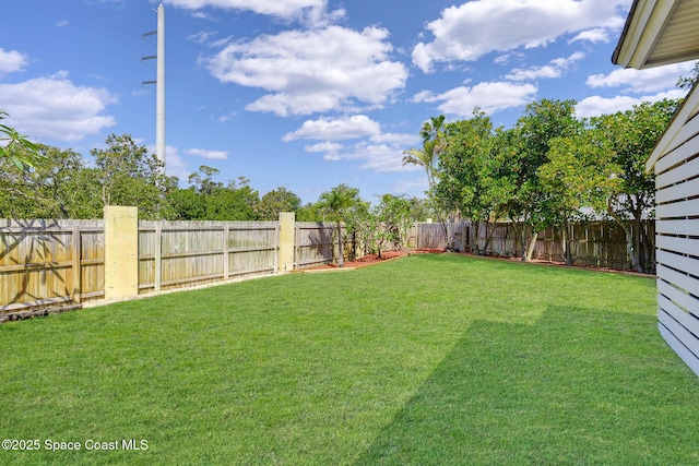 view of yard with a fenced backyard