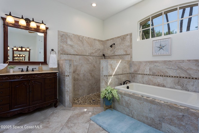 bathroom with recessed lighting, a bath, vanity, and a walk in shower