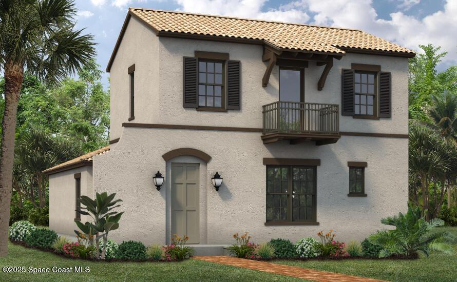 mediterranean / spanish house featuring stucco siding and a balcony